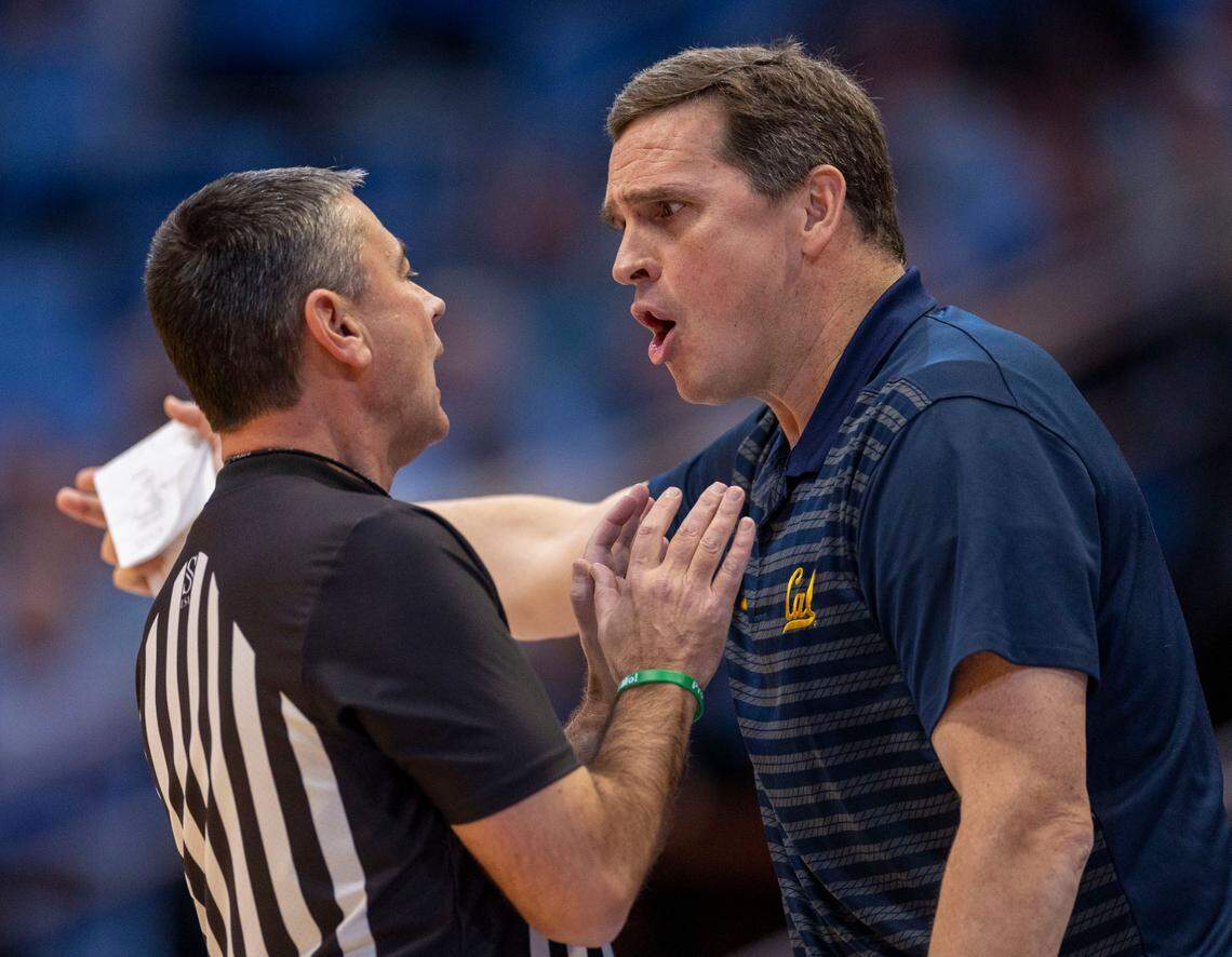 Official Pat Driscoll has a word with California head coach Mark Madsen in the first half against North Carolina on Wednesday, January 15, 2025 at the Smith Center in Chapel Hill, N.C.