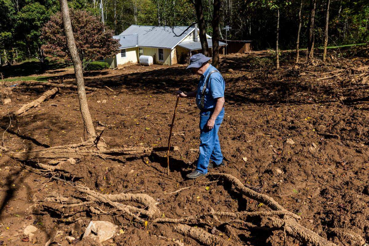Arlen Heatherly, 81, surveys damage caused by a landslide on his family’s property in Cruso. The remnants of Hurricane Helene caused more than 300 landslides, many in North Carolina.