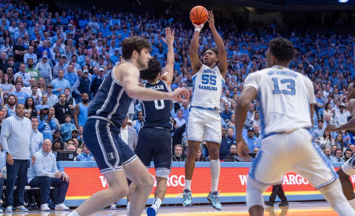 North Carolina’s Harrison Ingram (55) launches a three-point shot in the second half against Duke on Saturday, February, 3, 2024 at the Dean E. Smith Center in Chapel Hill, N.C. Ingram made 5 of 9 three point attempts and scored 21 points.