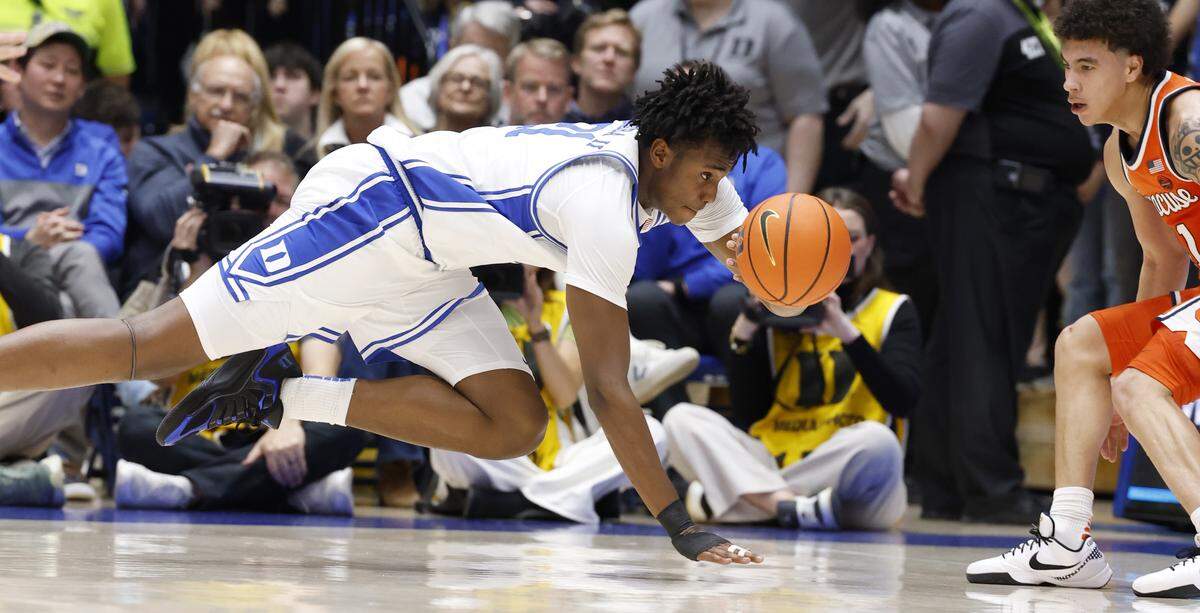 Duke’s Patrick Ngongba II (21) saves the ball from going out of bounds during the first half of Duke’s game against Syracuse at Cameron Indoor Stadium in Durham, N.C., Monday, Feb. 16, 2026.