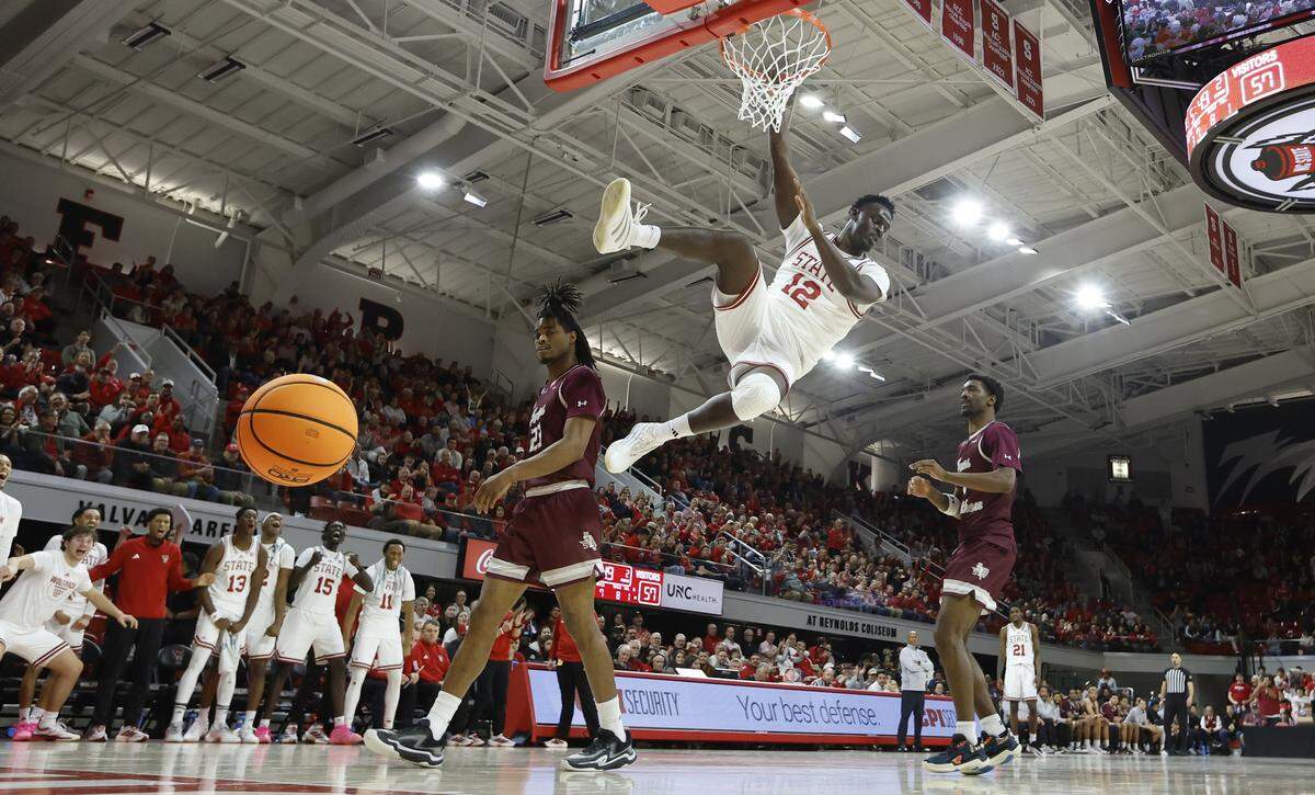 N.C. State's Scottie Ebube (12) slams in two during N.C. State’s 108-72 victory over Texas Southern at Reynolds Coliseum in Raleigh, N.C., Wednesday, Dec. 17, 2025.