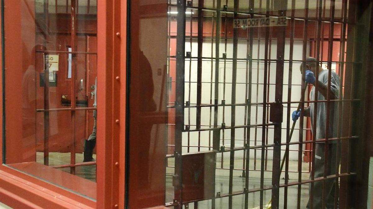 North Carolina’s minimum mandatory sentencing laws can lead to long prison sentences for people with no prior criminal record. Above, an inmate mops the floor of a restricted housing unit at North Carolina’s Lanesboro Correctional Institution.