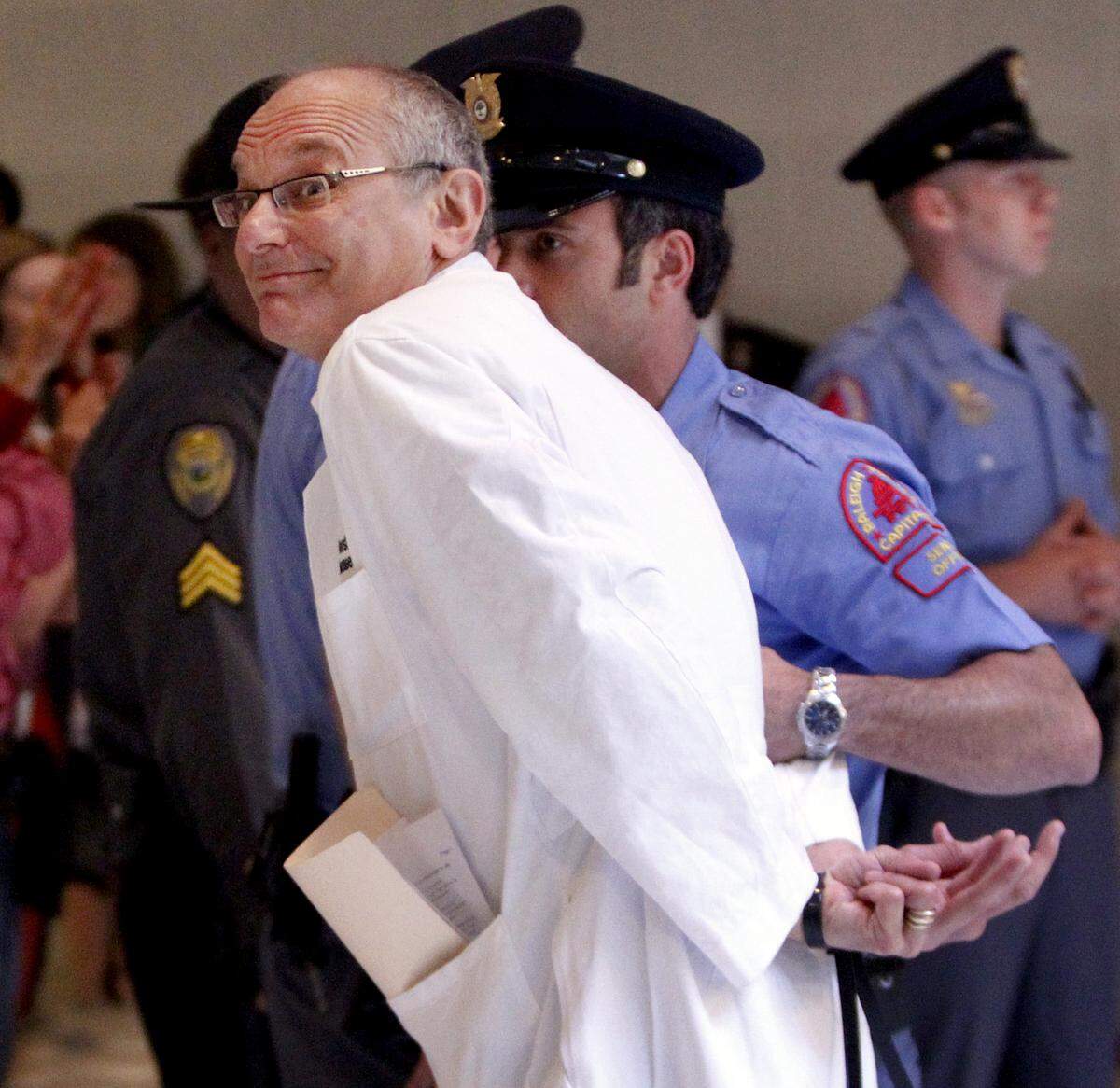Dr. Charles van der Horst is arrested during an act of civil disobedience condemning the Republican legislature’s agenda Monday, May 5, 2013, at the North Carolina State Legislative Building.Twenty-seven members of the state chapter of the National Association for the Advancement of Colored People and other activists were arrested by Raleigh and General Assembly police. Seventeen were arrested last week in a similar demonstration.