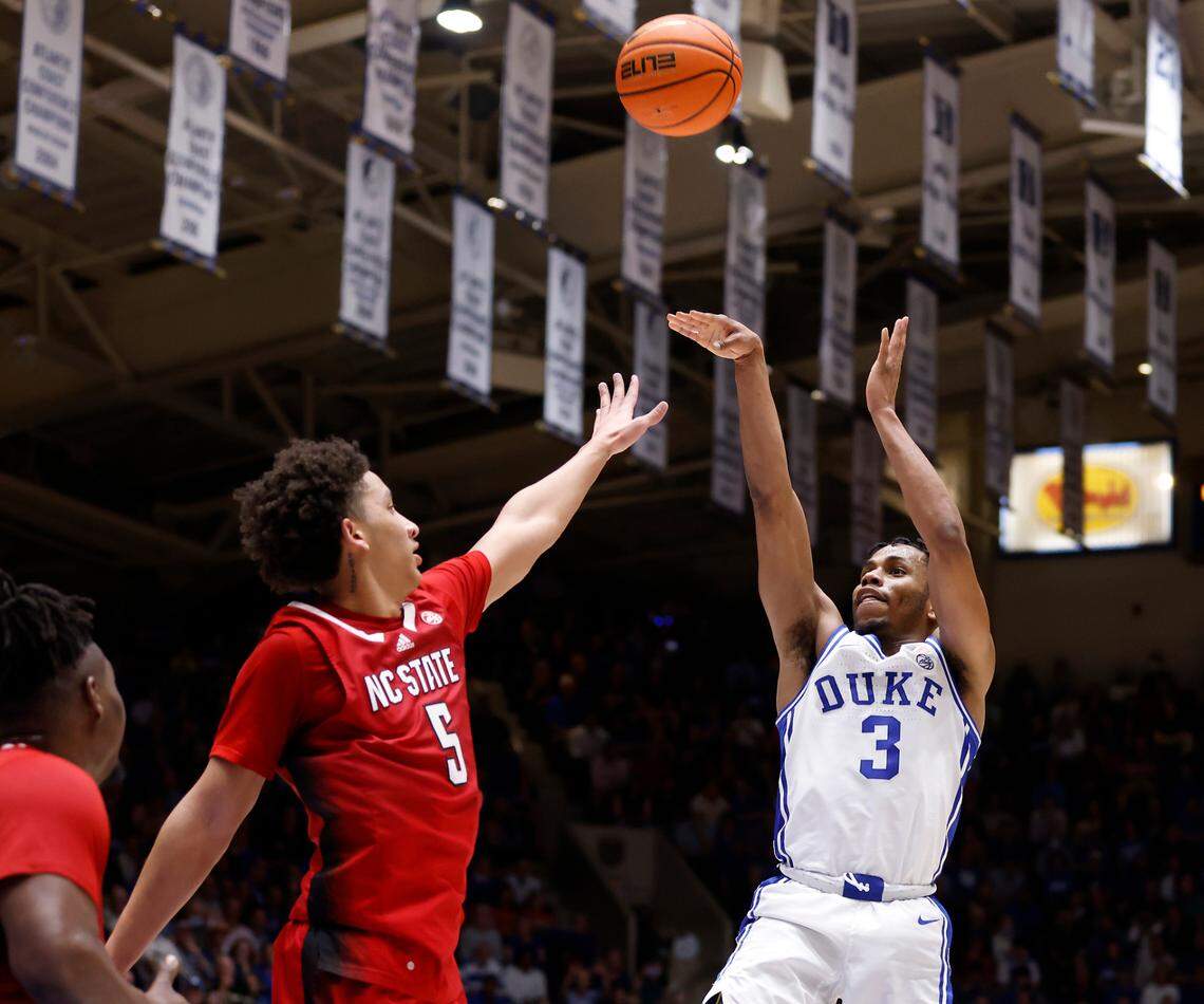 Duke’s Jeremy Roach shoots over N.C. State’s Jack Clark during the second half of Duke’s 71-67 win over N.C. State on Tuesday, Feb. 28, 2023, at Cameron Indoor Stadium in Durham, N.C.