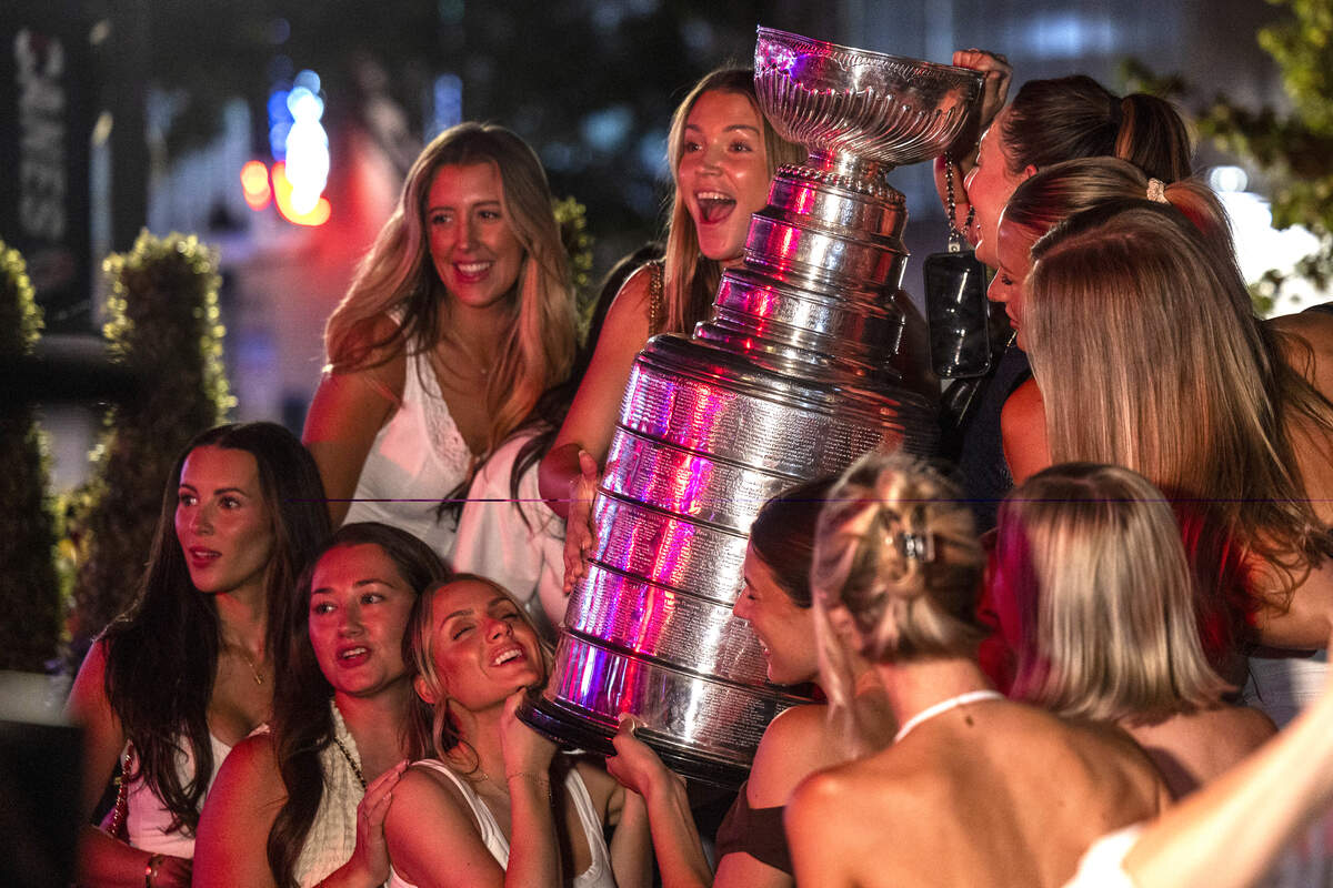 Carolina Hurricanes fans celebrate the team's Stanley Cup Final victory at Teets in Raleigh's Glenwood South district as the Stanley Cup, accompanied by Hurricanes players and staff, makes an appearance during a victory celebration Monday, June 15, 2026. The Hurricanes defeated the Vegas Golden Knights 4-2 in the Stanley Cup Final to win the franchise's second championship since 2006.