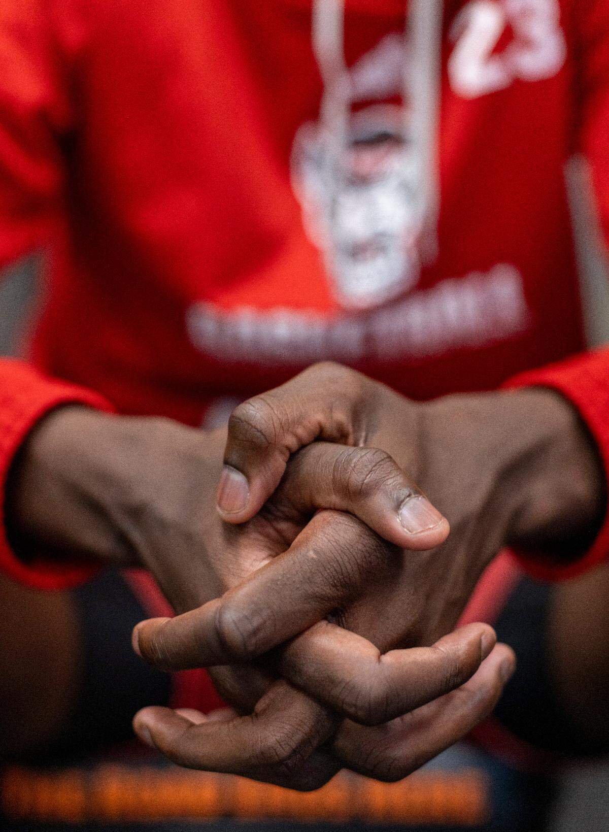 N.C. State’s Mohamed Diarra (23) cups his long fingers together as he takes questions in the locker room prior to the Wolfpack’s practice on Friday, April 5, 2024 at State Farm Stadium in Glendale, AZ.