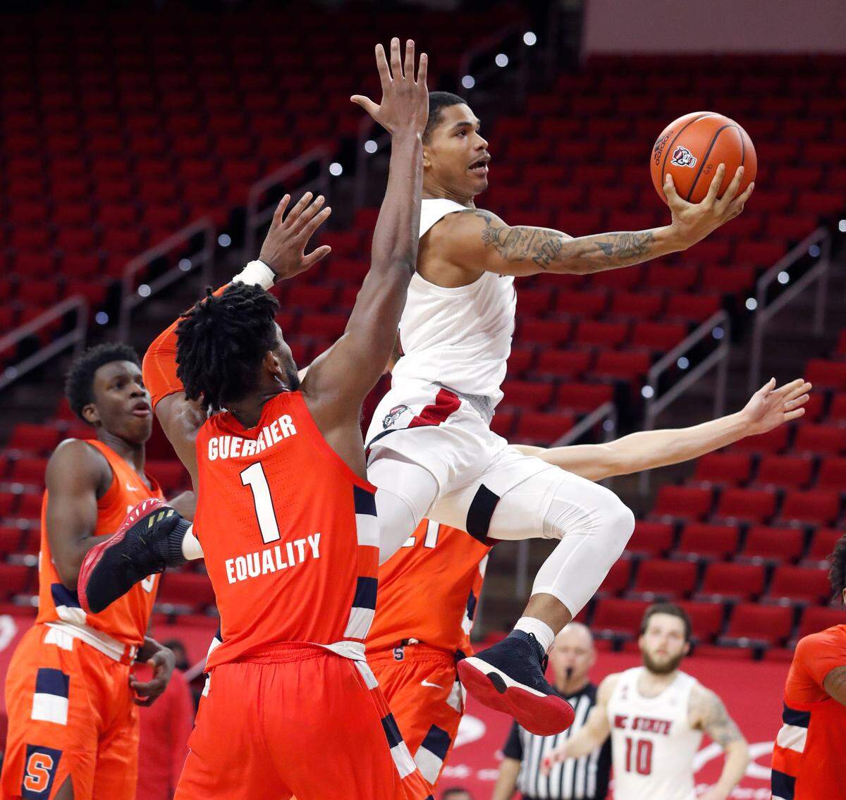 N.C. State’s Shakeel Moore (2) heads to the basket during the second half of Syracuse’s 77-68 victory over N.C. State at PNC Arena in Raleigh, N.C., Tuesday, February 9, 2021.