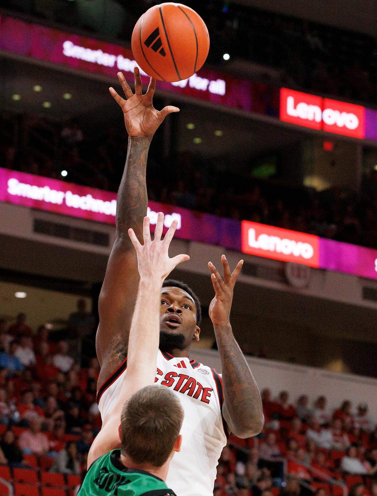 N.C. State’s Brandon Huntley-Hatfield shoots over USC Upstate’s Nic Book during the first half of the Wolfpack’s 97-66 win on Monday, Nov. 4, 2024, at Lenovo Center in Raleigh, N.C.