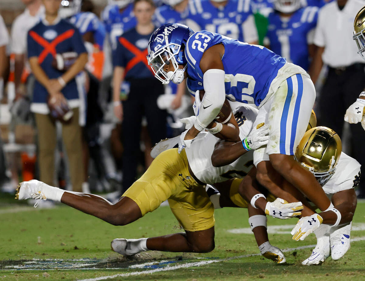 Duke’s Terry Moore is brought down by the Notre Dame defense during the first half of the Blue Devils’ game at Wallace Wade Stadium on Saturday, Sept. 30, 2023, in Durham, N.C.