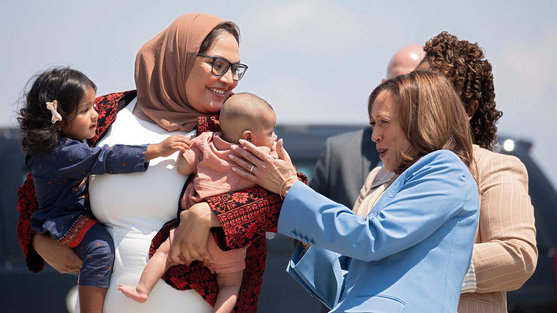 Vice President Kamala Harris greets little Abdul Allam Aziz, son of Durham County Board of Commissioners Chair Nida Allam as she works the receiving line after arriving at RDU in advance of her speech later in the day in Raleigh, N.C., Friday, Aug. 16, 2024. Allam is also holding daughter Aaliyah.