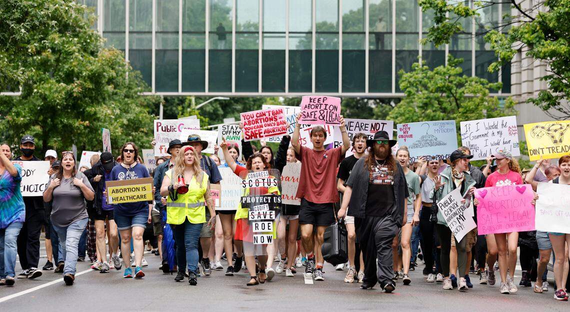 Protesters walk up N. Salisbury Street during the Bans Off Our Bodies abortion rights protest and march in downtown Raleigh, N.C., Saturday, May 14, 2022.