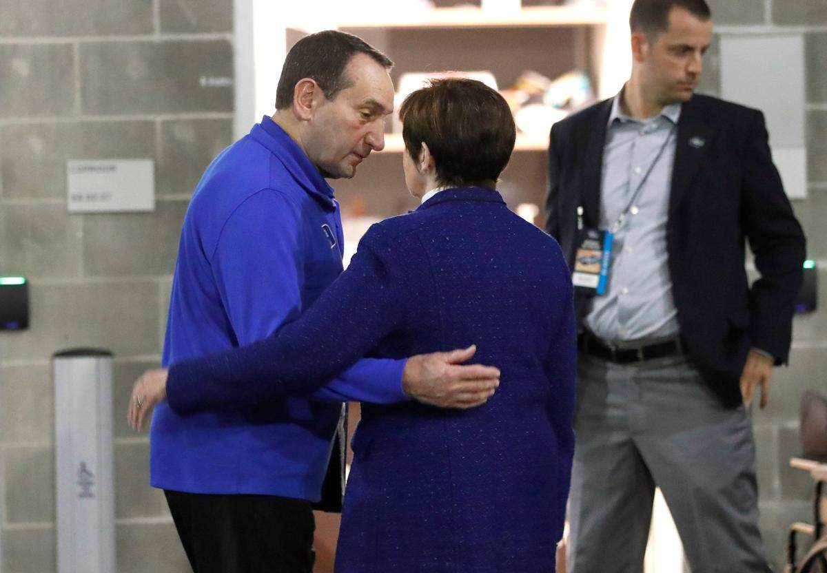 Duke head coach Mike Krzyzewski and his wife Mickie hug before Krzyzewski heads to the locker room at the Chase Center in San Francisco, Calif., before Dukes game against Texas Tech in the Sweet 16 round of the NCAA Tournament Thursday, March 24, 2022.