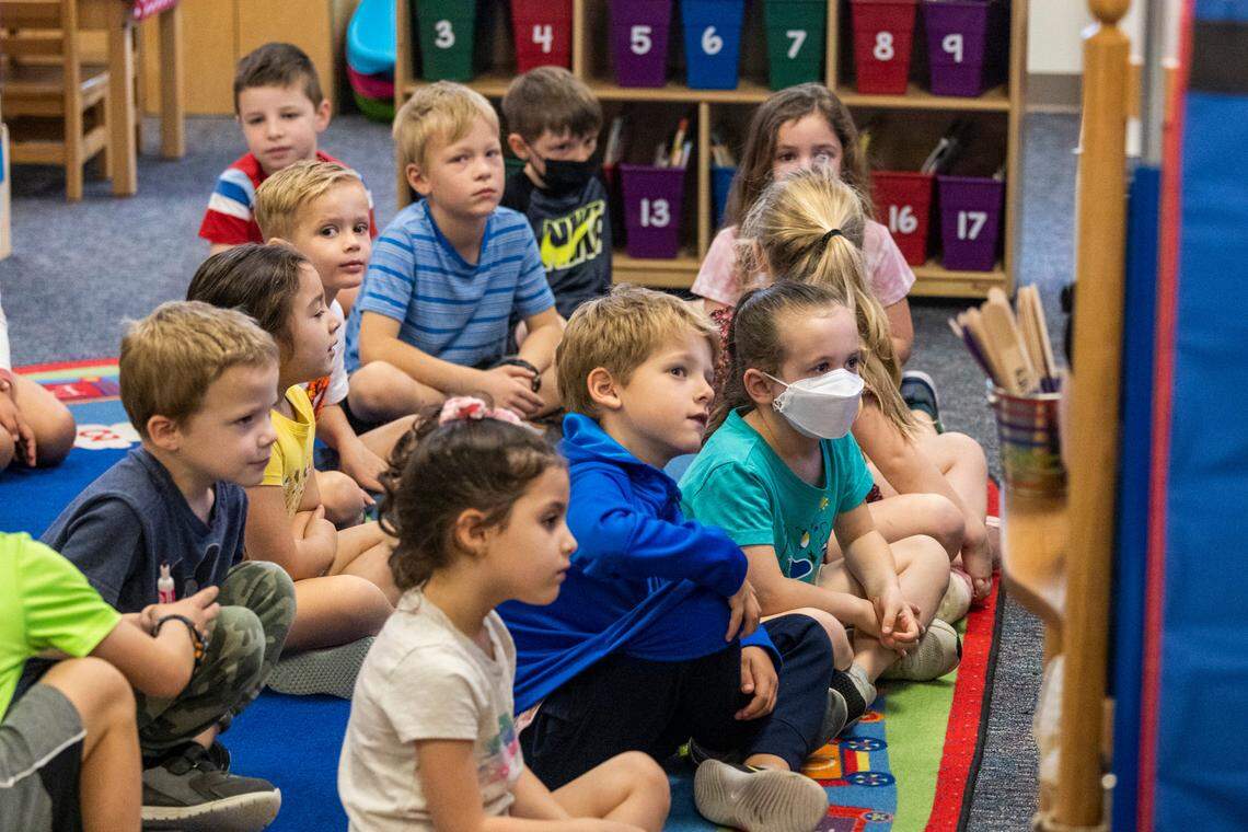 Most students in Holly Berk’s kindergarten class elected not to wear masks Monday, March 7, 2022 at Scotts Ridge Elementary in Apex. Monday marked the first day that face masks are now optional in Wake County schools.