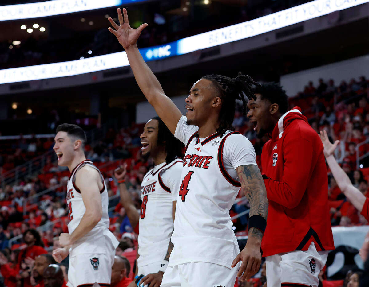 The N.C. State bench reacts after a basket by Jordan Snell late in the second half of the Wolfpack’s 89-63 win over Rider on Sunday, Dec. 22, 2024, at Lenovo Center in Raleigh, N.C.