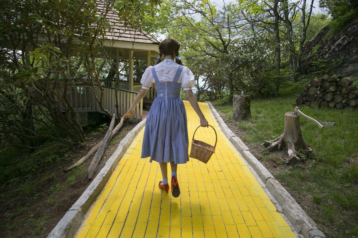 Dorothy takes visitors to the Land of Oz atop Beech Mountain for a tour of the yellow brick road during the Journey with Dorothy event on Friday, June 8, 2018. Fans of attraction were distraught over its sudden, announced closing on Friday, March 14, 2025.