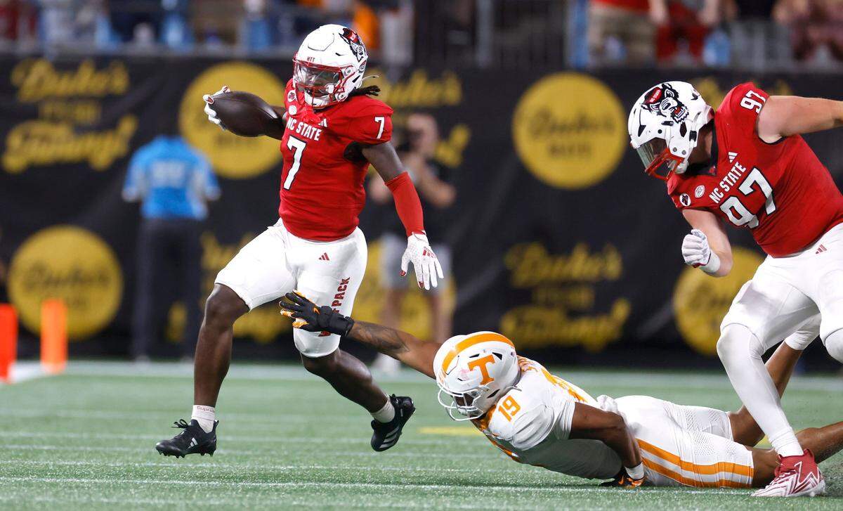 N.C. State safety Bishop Fitzgerald (7) returns an interception during the first half of N.C. State’s game against Tennessee in the Duke’s Mayo Classic at Bank of America Stadium in Charlotte, N.C., Saturday, Sept. 7, 2024.