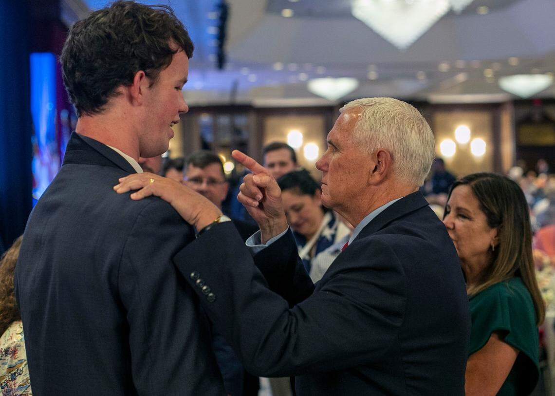 Former Vice President Mike Pence, a 2024 presidential candidate, talks with Dan Lancaster of Wayne County, prior to his address to the North Carolina Republican Party Convention at the Koury Convention Center on Saturday, June 10, 2023 in Greensboro, N.C.