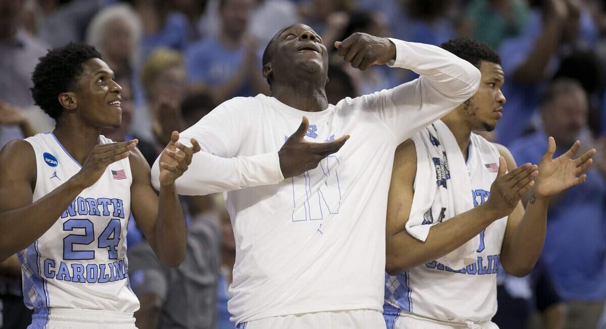 North Carolinas Kenny Williams (24) and Joel James (42) react after a dunk by teammate Brice Johnson in the second half against Providence in the second round of the NCAA Tournament on Saturday, March 19, 2016 at the PNC Arena in Raleigh, N.C.