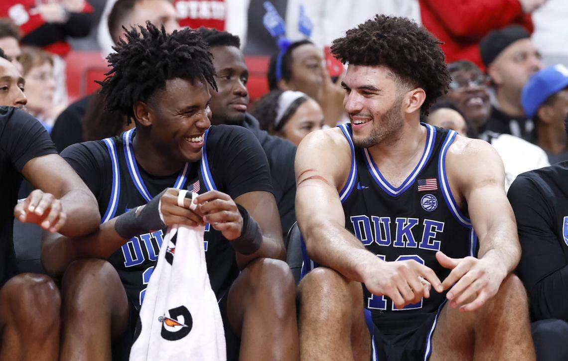 Duke’s Patrick Ngongba II (21) laughs with Cameron Boozer (12) late in the second half of Duke’s 93-64 victory over N.C. State at the Lenovo Center in Raleigh, N.C., Monday, March 2, 2026.