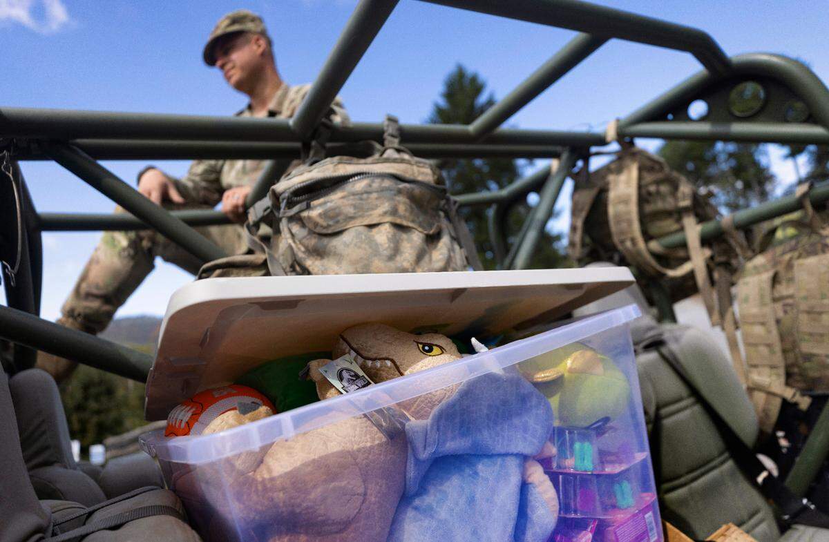 Soldiers with the 101st Airborne Division Air Assault, 2nd Brigade Combat Team, from Fort Campbell, Kentucky, use Infantry Squad Vehicles to deliver water, food, toiletries, and other aid to residents in the Soco Gap community in Maggie Valley on Tuesday, October. 8, 2024. The team has been using the Maggie Valley Pavilion and Town Hall as a distribution base for relief efforts in the town following Tropical Storm Helene.