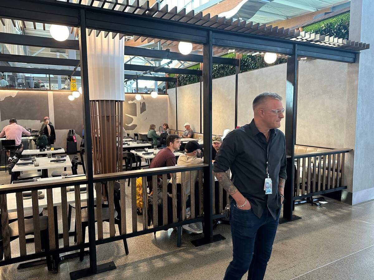 Scott Crawford in front of his new restaurant, Crawford’s Genuine, in Terminal 2 at Raleigh-Durham International Airport.