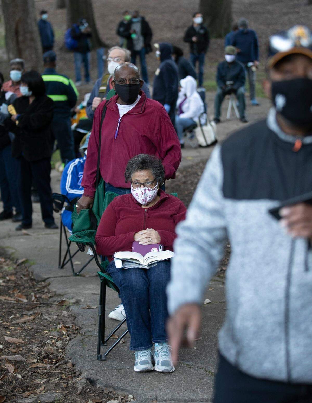People wait in line to vote on Thursday morning, October 15, 2020 at Roberts Park in Raleigh, N.C. More than 300 people who were in line when the poll opened at 8 a.m..