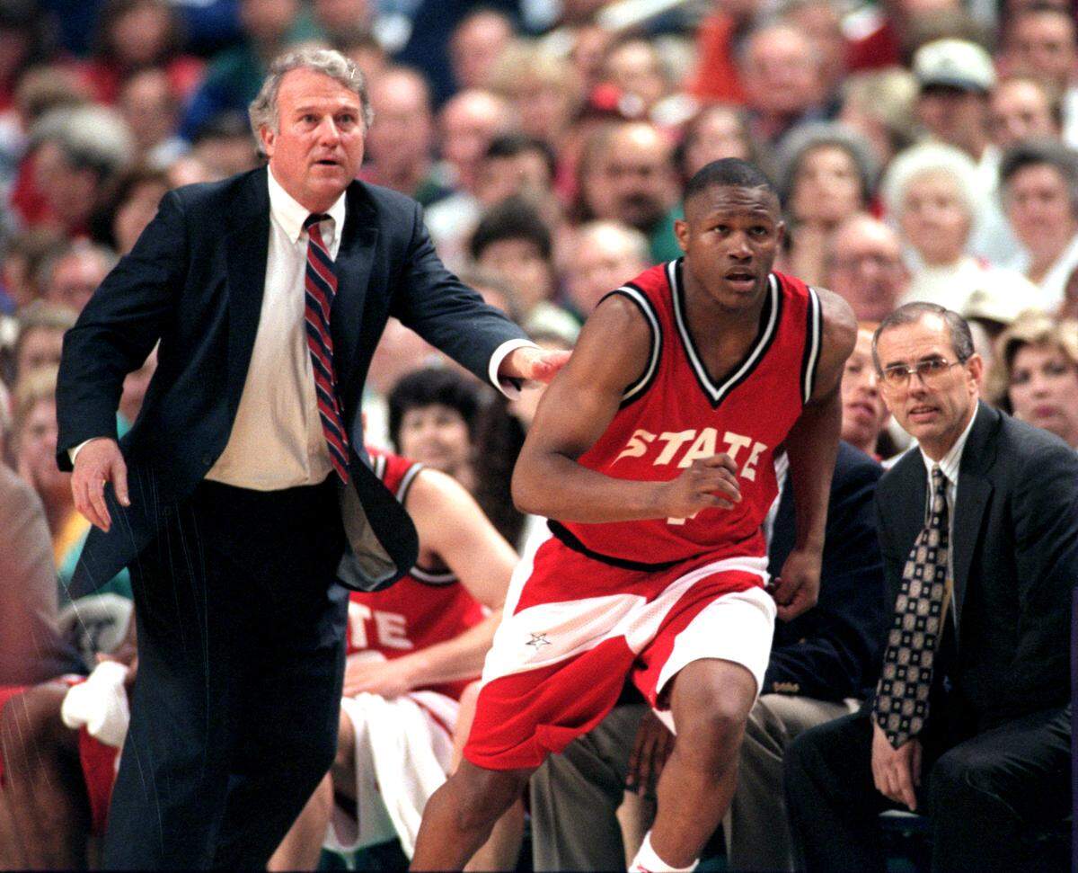 N.C. State head coach Les Robinson instructs Ivan Wagner as he runs up court during the first round of the ACC Tournament in the Greensboro Coliseum in March 1996.