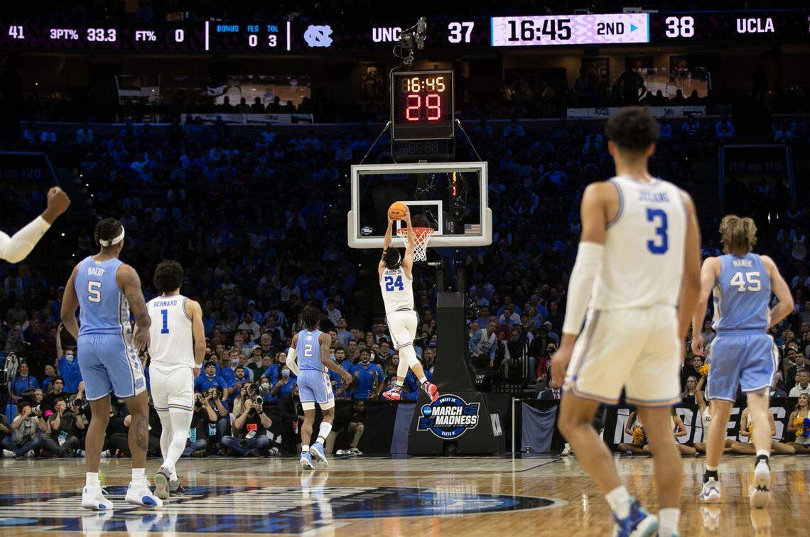 UCLA’s Jaime Jaquez Jr. (24) gets a dunk on a fast break after a steal from North Carolina in the second half on Friday, March 25, 2022 during the NCAA East Regional semi-final at Wells Fargo Center in Philadelphia, Pa.