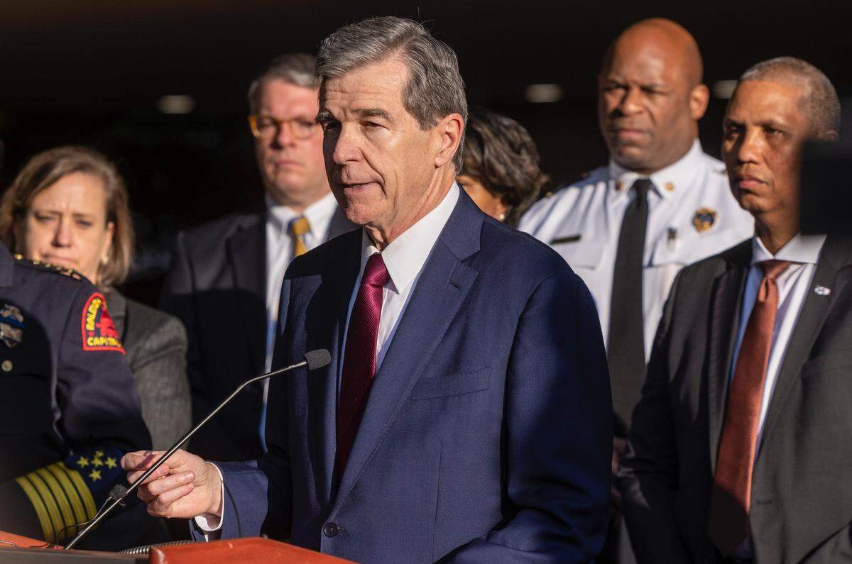 Gov. Roy Cooper speaks during a press conference Friday, Oct. 14, 2022 outside the Avery C. Upchurch Municipal Complex in Raleigh following a mass shooting that left 5 people dead Thursday in Raleigh’s Hedingham neighborhood.
