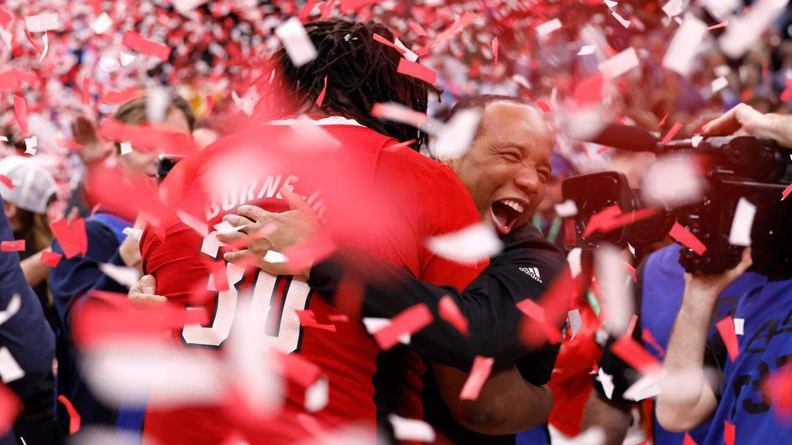 N.C. State’s head coach Kevin Keatts hugs DJ Burns Jr. (30) after N.C. State’s 84-76 victory over UNC in the championship game of the 2024 ACC Men’s Basketball Tournament at Capital One Arena in Washington, D.C., Saturday, March 16, 2024.