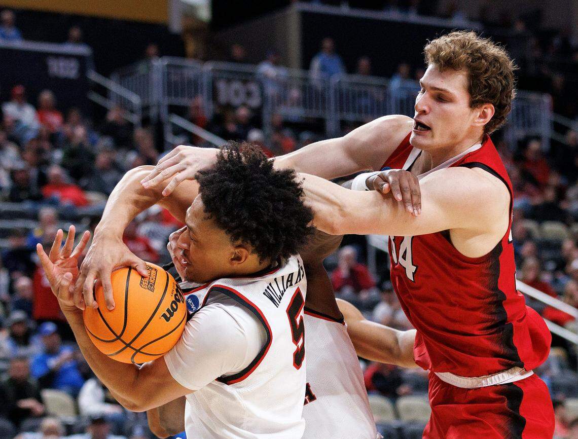 Texas Tech’s Darrion Williams and N.C. State’s Ben Middlebrooks battle for a rebound during the second half of the Wolfpack’s 80-67 win in first round of the NCAA Tournament on Thursday, March 21, 2024, at PPG Paints Arena in Pittsburgh, Pa.