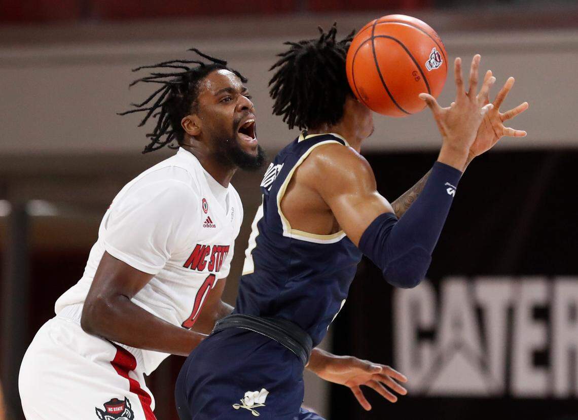 N.C. State’s D.J. Funderburk (0) pressures Charleston Southern’s Terence Porter Jr. (1) during N.C. State’s game against Charleston Southern in the Wolfpack Invitational at Reynolds Coliseum in Raleigh, N.C., Wednesday, Nov. 25, 2020.