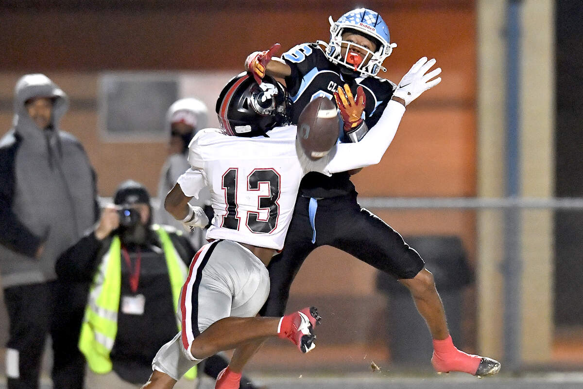 Rolesville’s Jovon Wright (13) interrupts the pass to Cleveland’s Krisjon Clark (16) during the first half. The Rolesville Rams and the Cleveland Rams met in the fourth round of the NCHSAA 4A football playoffs in Clayton, N.C. on December 6, 2024.