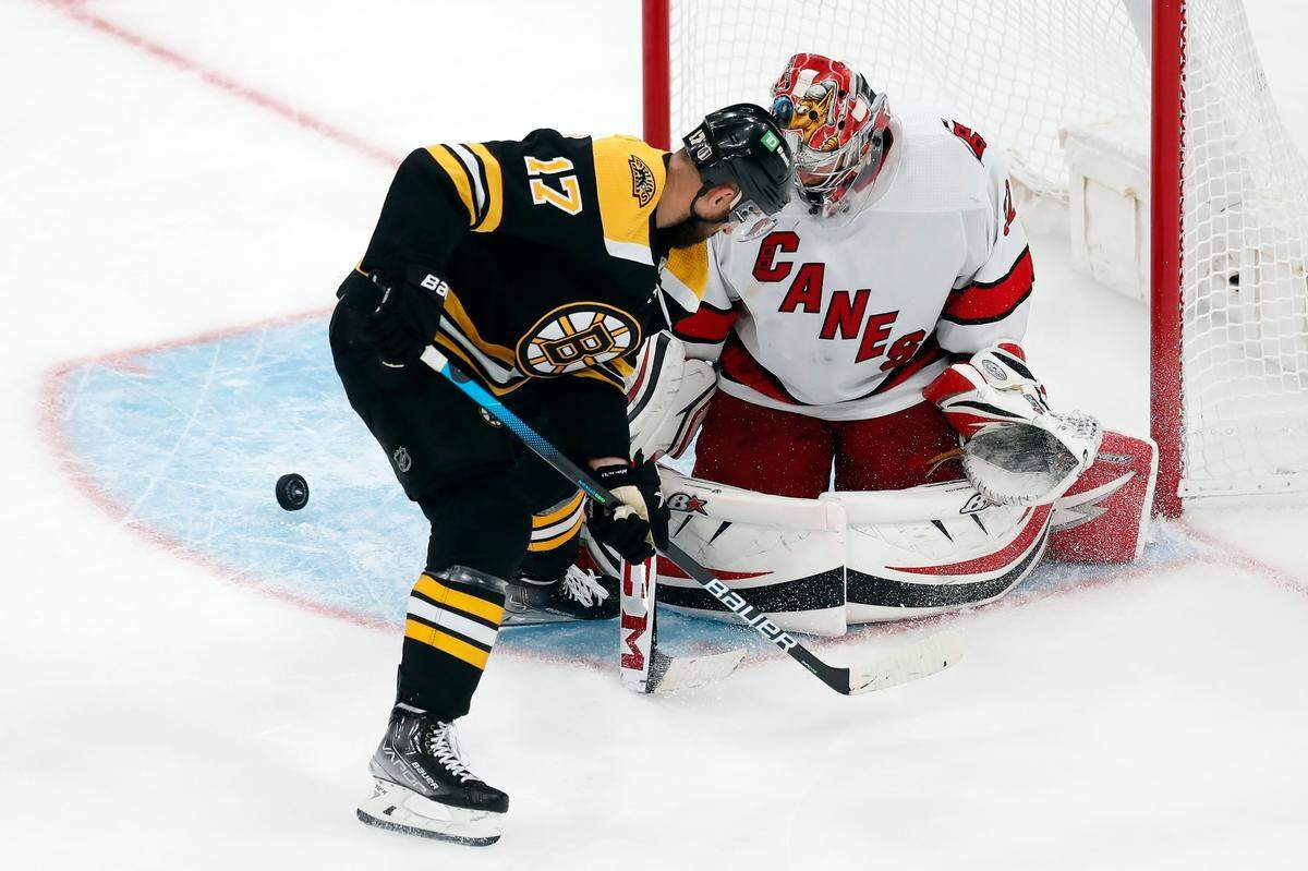 Boston Bruins’ Nick Foligno (17) tries to score on Carolina Hurricanes’ Antti Raanta (32) during the third period in Game 6 of an NHL hockey Stanley Cup first-round playoff series, Thursday, May 12, 2022, in Boston. (AP Photo/Michael Dwyer)