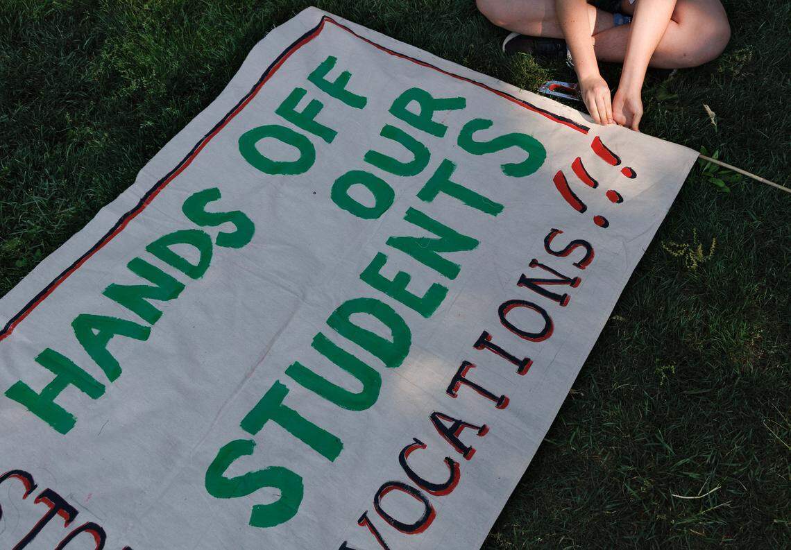 A person assembles a sign on UNC-Chapel Hill’s Polk Place on Tuesday, April 29, 2025, during a gathering to mark the anniversary of the Pro-Palestinian tent encampment.
