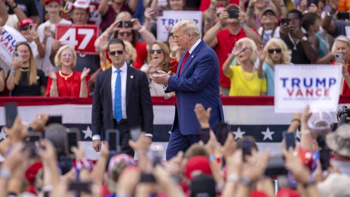 Former President Donald Trump takes the stage during a rally at the North Carolina Aviation Museum & Hall of Fame in Asheboro, NC on Wednesday, Aug. 21, 2024.