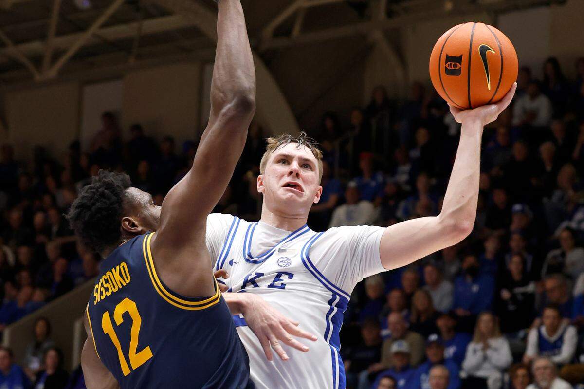 Duke’s Cooper Flagg (2) heads to the basket as California’s Mady Sissoko (12) defends during the first half of Duke’s game against Cal at Cameron Indoor Stadium in Durham, N.C., Wednesday, Feb. 12, 2025.