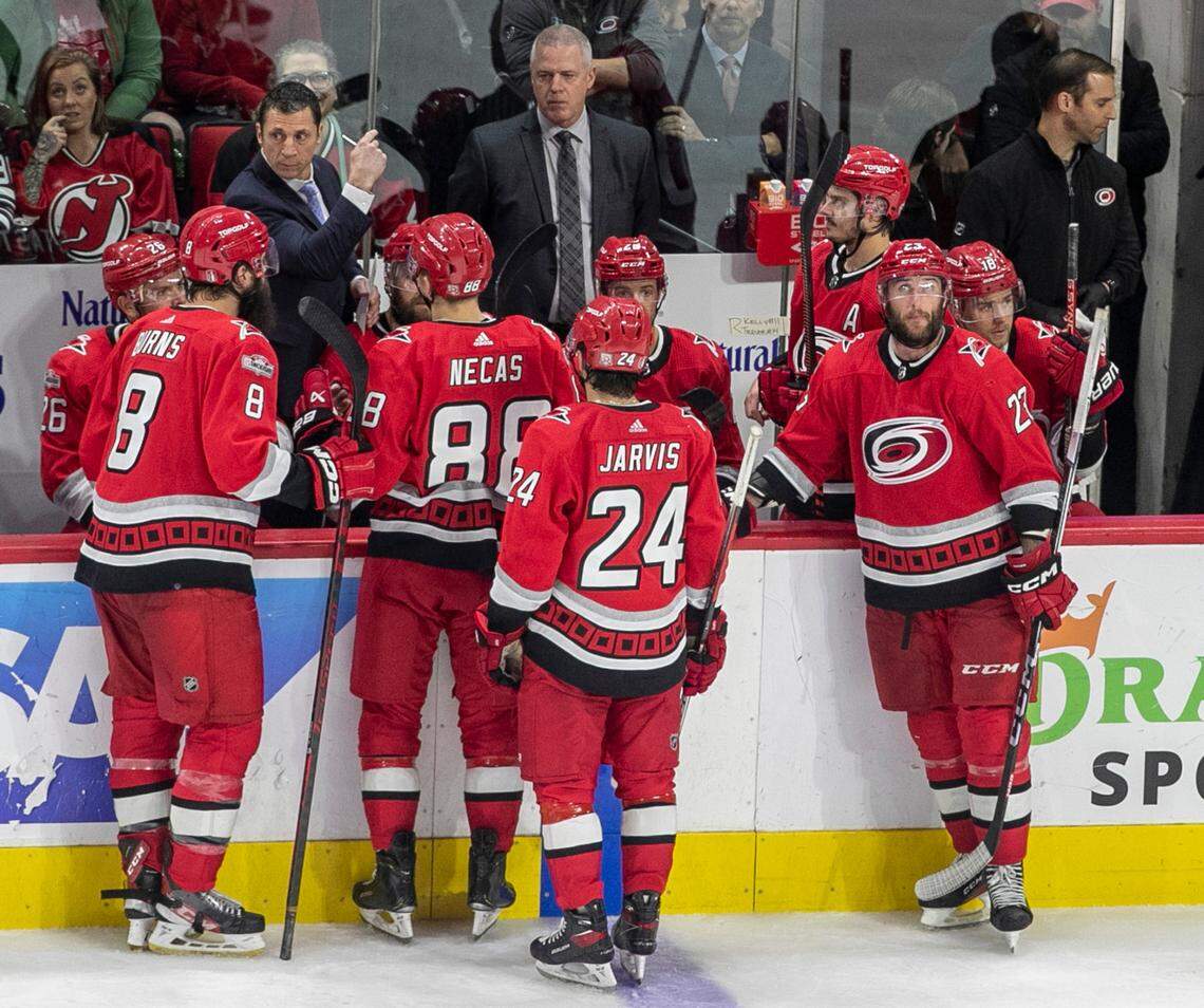Carolina Hurricanes coach Rod Brind’Amour huddles with his team during a time out in the overtime period against the New Jersey Devils during Game 5 of their second round Stanley Cup playoff series on Thursday, May 11, 2023 at PNC Arena in Raleigh, N.C.