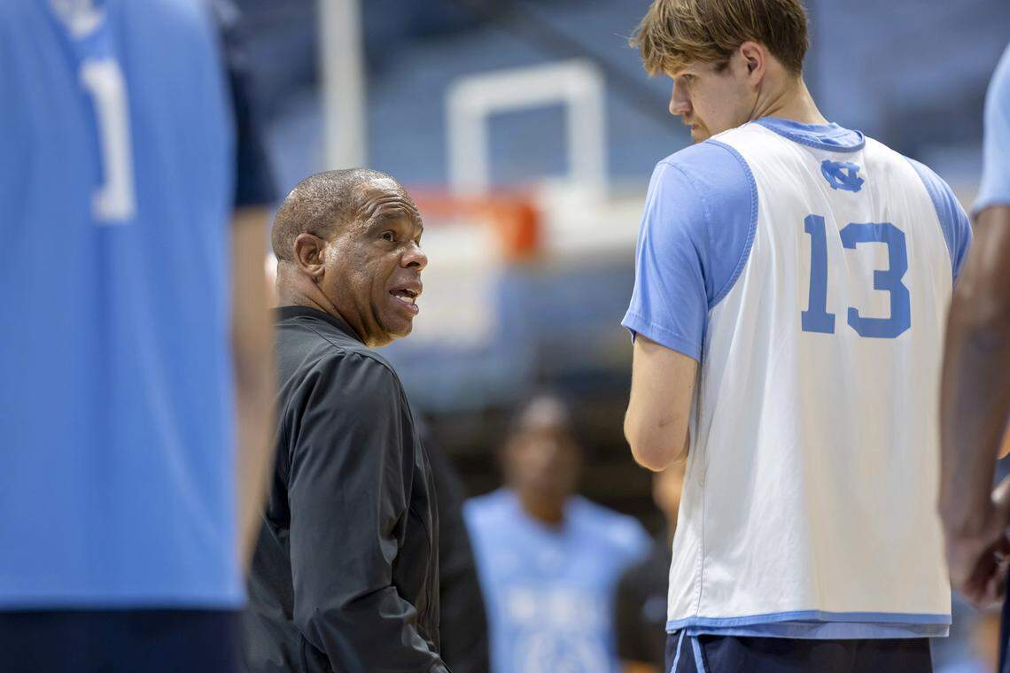 Coach Hubert Davis works with center Henri Veesaar (13) during practice on Thursday, October 9. 2025 at the Smith Center in Chapel Hill, N.C.