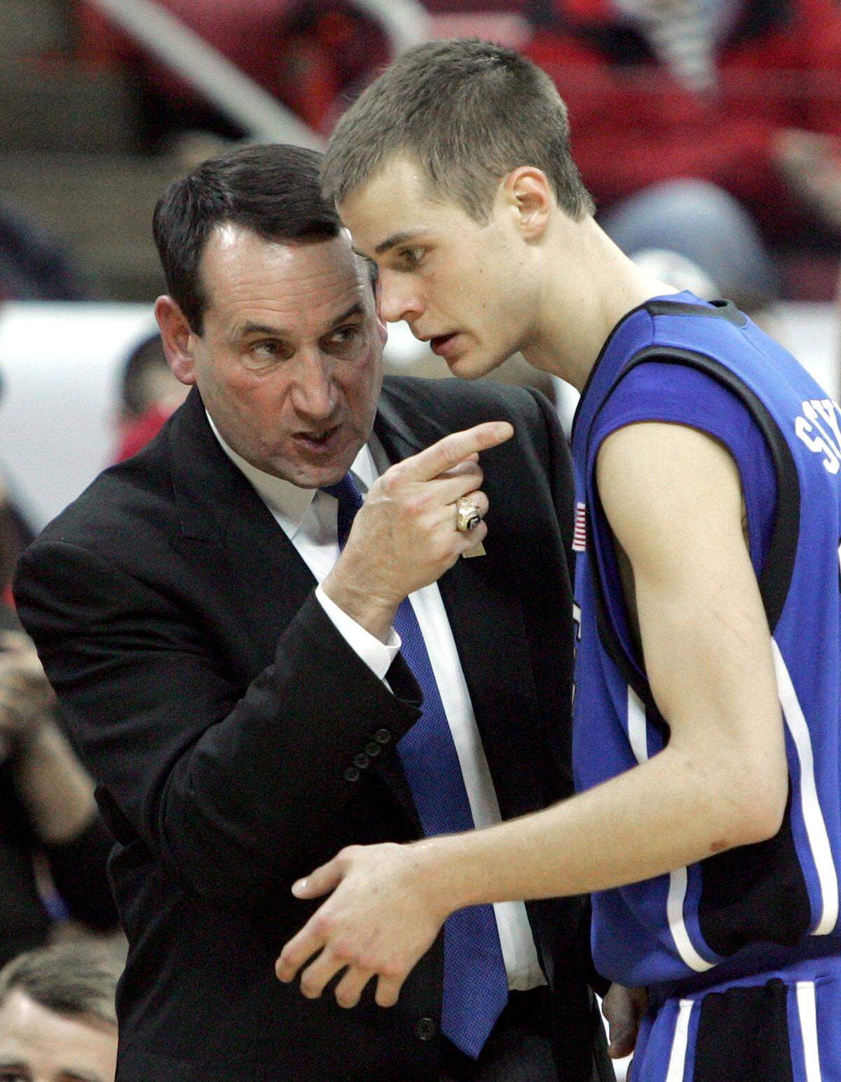 Duke coach Mike Krzyzewski confers with Duke’s Jon Scheyer during the second half of the Blue Devils’ 87-86 win at the RBC Center on Saturday, March 1, 2008.