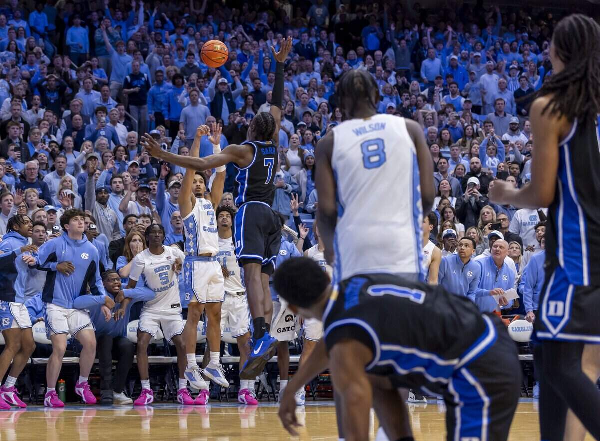 North Carolina guard Seth Trimble (7) launches a three-point shot with .4 seconds to play against Duke to win the game 71-68 on Saturday, February 7, 2026 at the Smith Center in Chapel Hill, N.C.