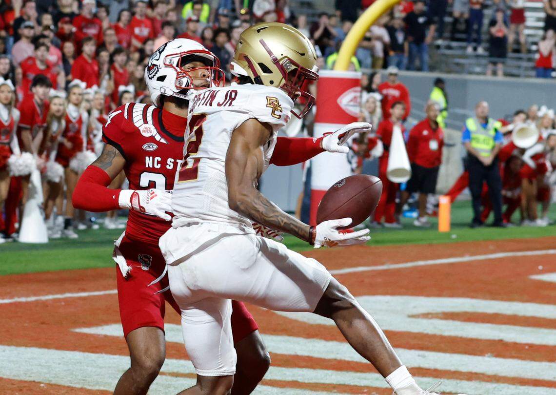 Boston College wide receiver Joseph Griffin Jr. (2) catches the game winning touchdown as N.C. State cornerback Derrek Pitts Jr. (24) defends late in the fourth quarter of Boston College’s 21-20 victory over N.C. State at Carter-Finley Stadium in Raleigh, N.C., Saturday, Nov. 12, 2022.