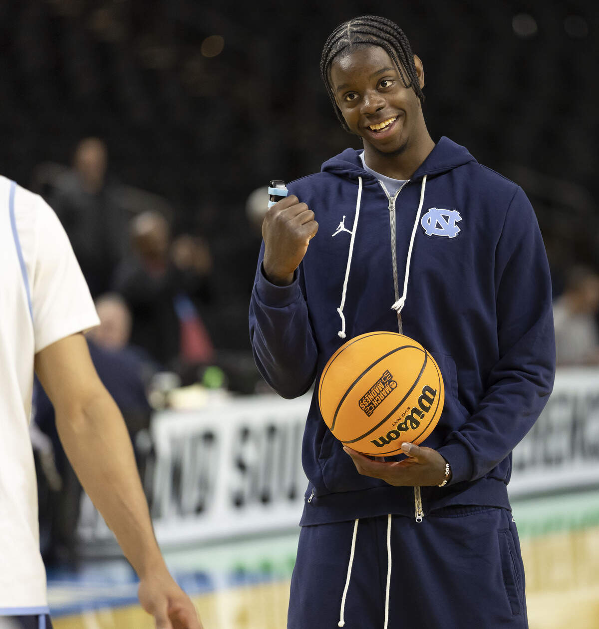 North Carolina forward Caleb Wilson, out with a broken thumb, smiles as he watches his teammates practice on Wednesday, March 18, 2026, at Bon Secours Arena in Greenville, S.C.