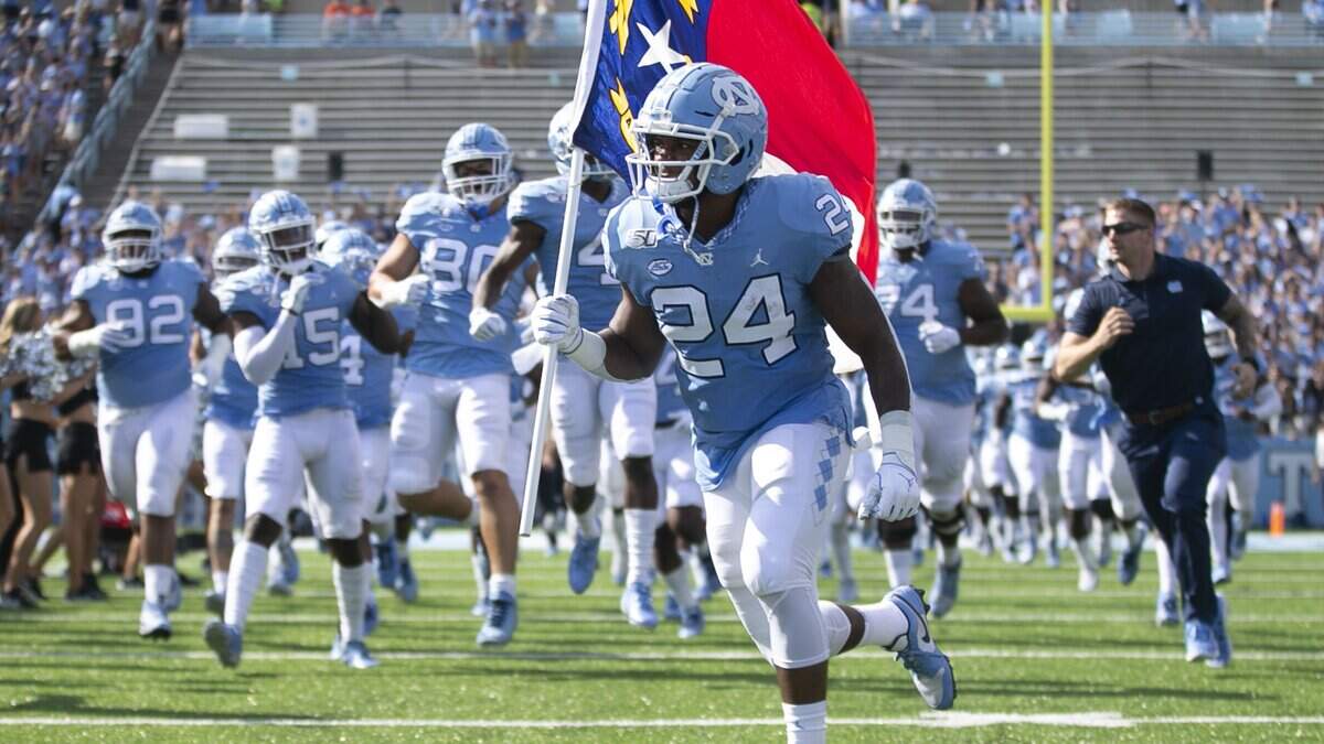 The field at UNC’s Kenan Stadium is being named after Chris Smith, a member of the Rams Club executive board.