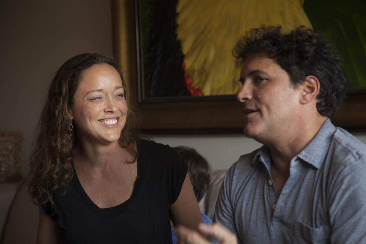 Misty and Matt Hedspeth sit on the couch at their home, discussing how they felt called by God to help orphaned children in Panama.