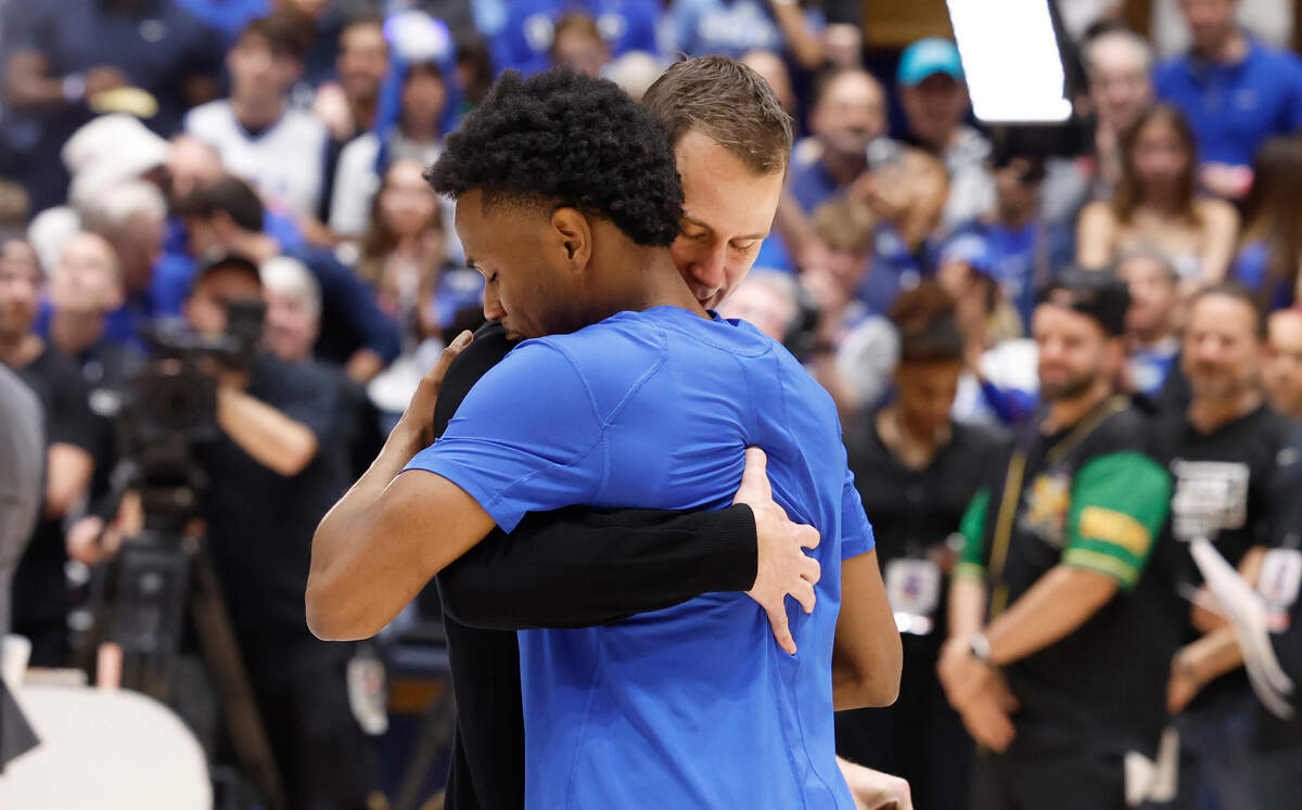 Duke’s head coach Jon Scheyer hugs Jeremy Roach during senior day ceremonies before Duke’s game against UNC at Cameron Indoor Stadium in Durham, N.C., Saturday, March 9, 2024.