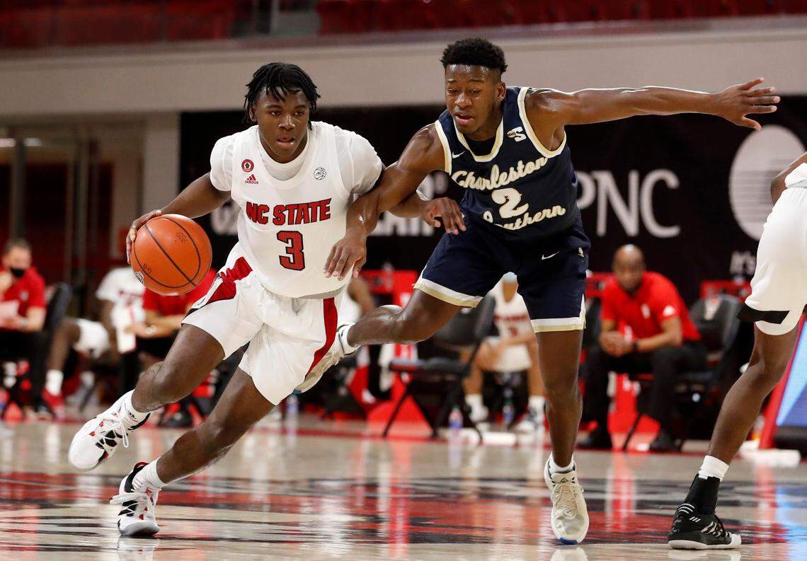 N.C. State’s Cam Hayes (3) drives around Charleston Southern’s Emorie Knox (2) during N.C. State’s game against Charleston Southern in the Wolfpack Invitational at Reynolds Coliseum in Raleigh, N.C., Wednesday, Nov. 25, 2020.