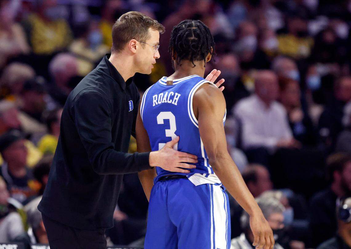 Duke associate head coach Jon Scheyer talks with Jeremy Roach (3) during the second half of Duke’s 76-64 victory over Wake Forest at LJVM Coliseum in Winston-Salem, N.C., Wednesday, January 12, 2022.