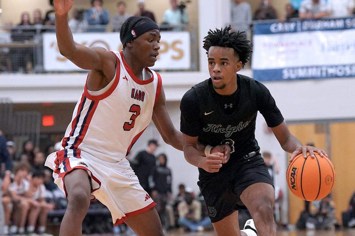 Greenfield's Kobe Edwards (3) drives to the basket against Coronado's Demari Hunter (3) during the second half. The Greenfield Knights and the Coronado Cougars (Nevada) met in the finals of the Day'Ron Sharpe bracket of the  John Wall Holiday Tournament in Raleigh, N.C. on December 30, 2025.