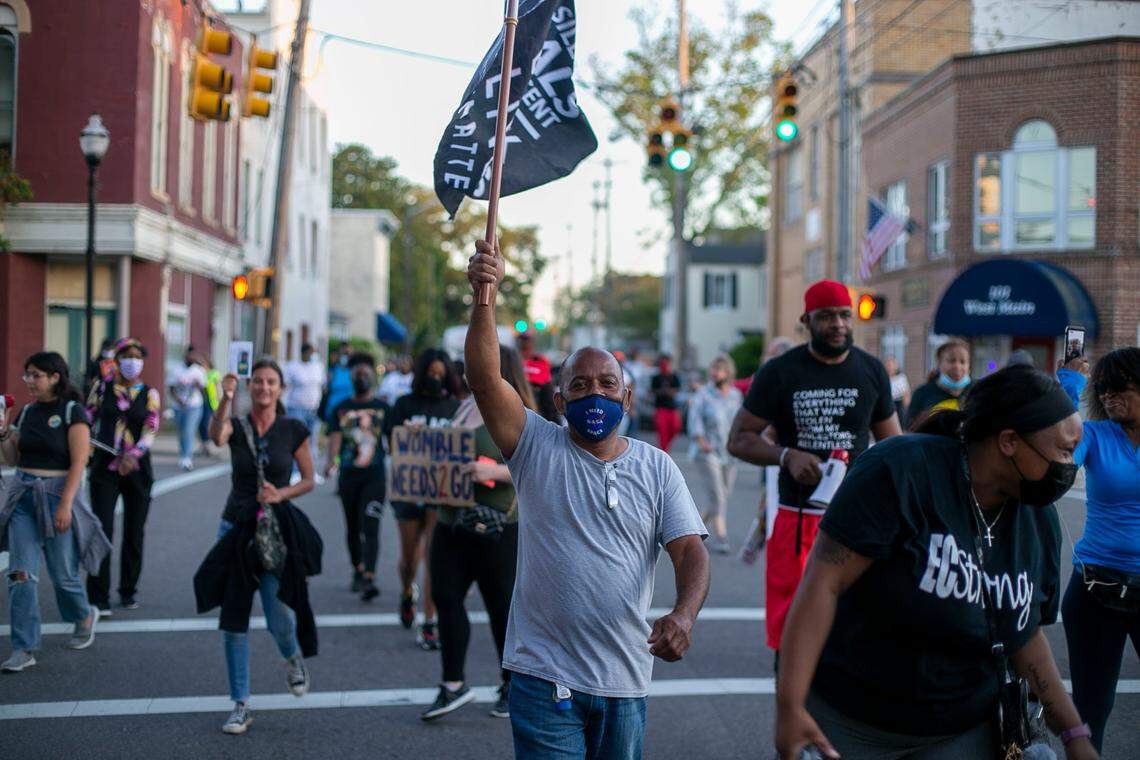 Demonstrators cross Main Street calling for justice in the Andrew Brown Jr. case on Friday, May 21, 2021 in Elizabeth City, N.C. Demonstrators have marched for more than 30 days following the death of Andrew Brown Jr. at the hands of Pasquotank County deputies who were serving an arrest warrant last month.